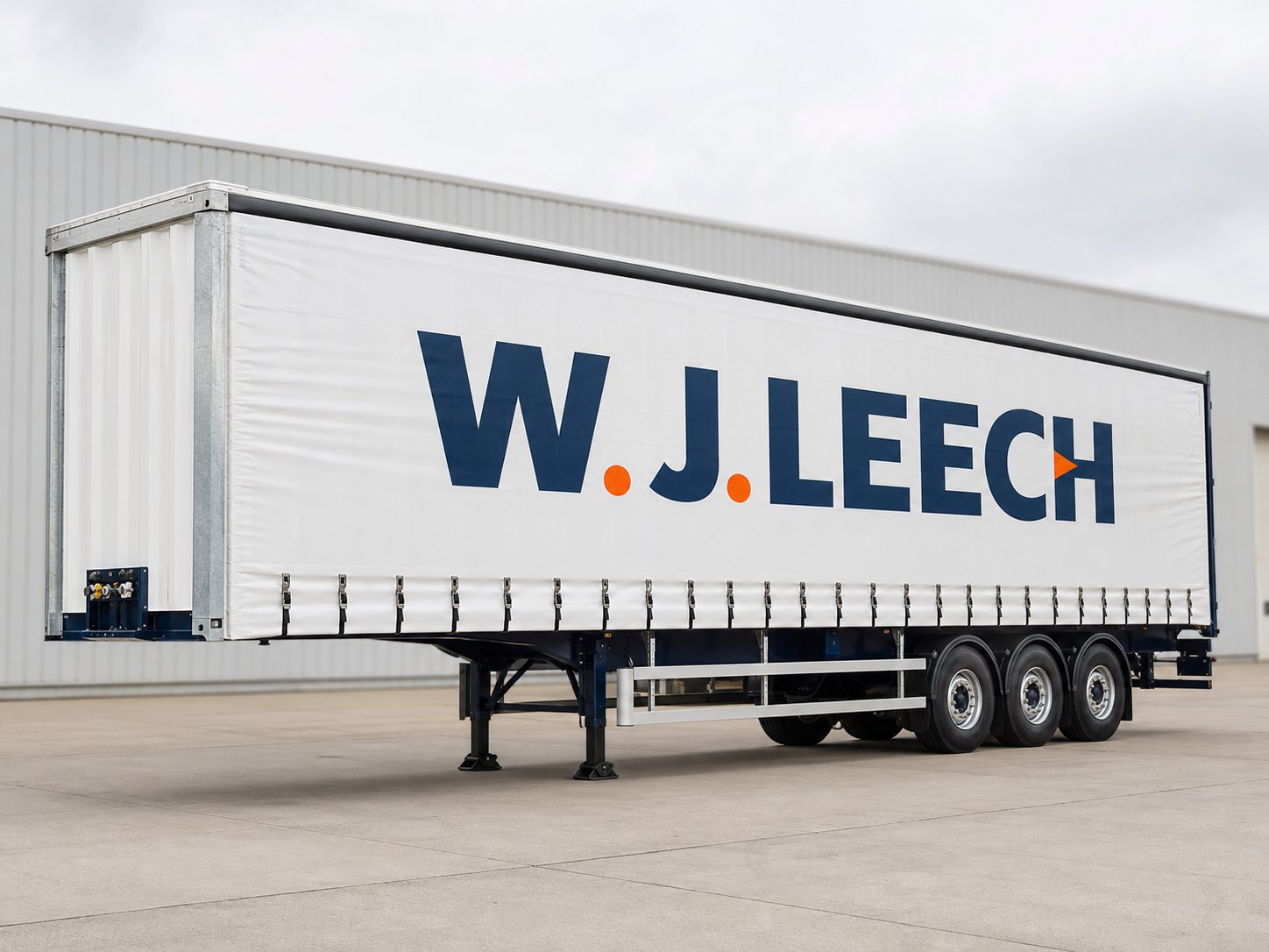 White curtainside trailer with printed W.J.LEECH logo curtain